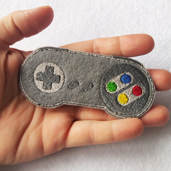 Bling! Handmade, Nintendo SNES Controller, Nintendo SNES Controller Patch, Nintendo Controller Patch, Patch, SNES Patch, Nintendo Patch, Arcade, Neo Geo, neogeo, Nintendo, Sega, Playstation, Atari, Jamma, Gaming, Videogame, Videogames, Pixel, Art, Patches, Embroidery, Bordados, Handmade, Emblems, Emblema, Applique, Pin, Badges, Uniform, Hat, Backpack, Clothing, Clothes, Velcro, Jackets, Gifts, Jeans